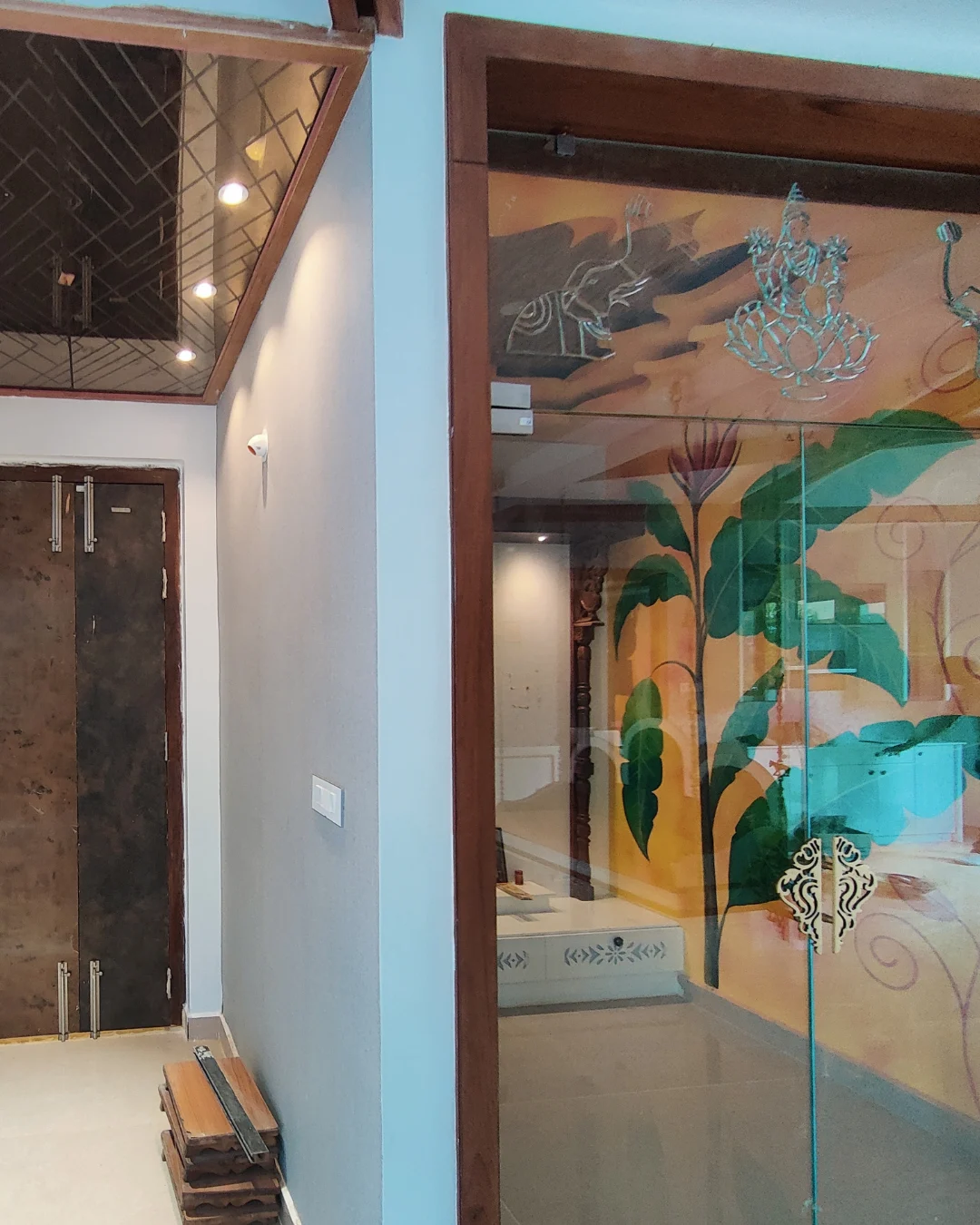 Traditional pooja room with botanical murals and decorative detailing in the Nizamabad luxury villa